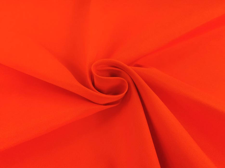 Zdjęcie przedstawiające pomarańczową tkaninę wodoodporną, Elanobawełnę Biver w odcieniu jaskrawym