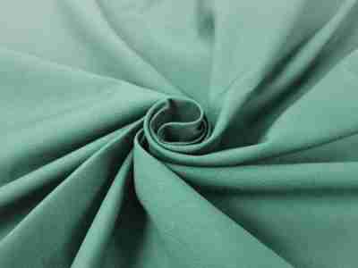 Zdjęcie przedstawiające przybliżenie na zielona tkaninę bawełnianą drelichową 2702