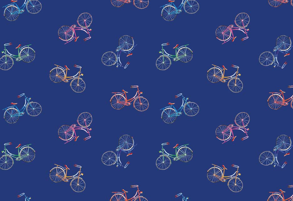 Zdjęcie prezentujące wzór do druku na tkaninach poliestrowych, motyw z kolorowymi rowerami na granatowym tle