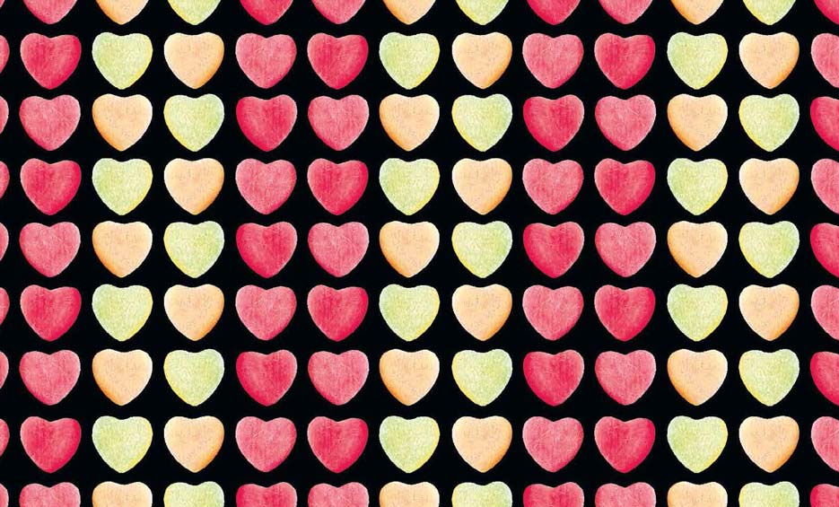 Zdjęcie przedstawiające wzór do druku na tkaniny i dzianiny w serca, odcienie czerwieni, pomarańczu i zieleni na czarnym tle
