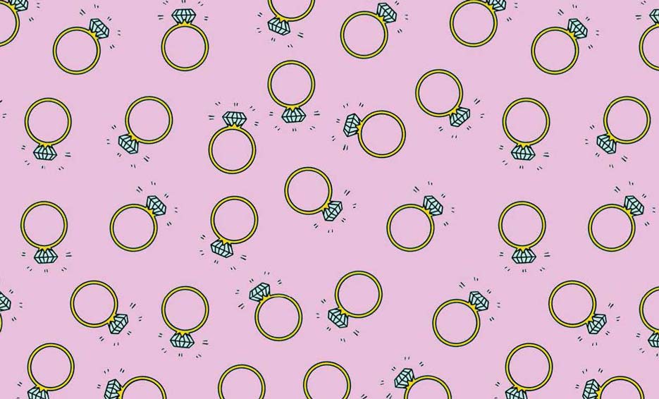 Zdjęcie przedstawiające wzór do nadruku na tkaniny i dzianiny, złote pierścionki z brylantem na różowym tle